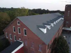 Second Wind for an Old Mill: Guaranteed Roofing Revamps Killingly Roof